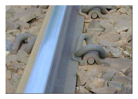 (b) PR-clip installed on track